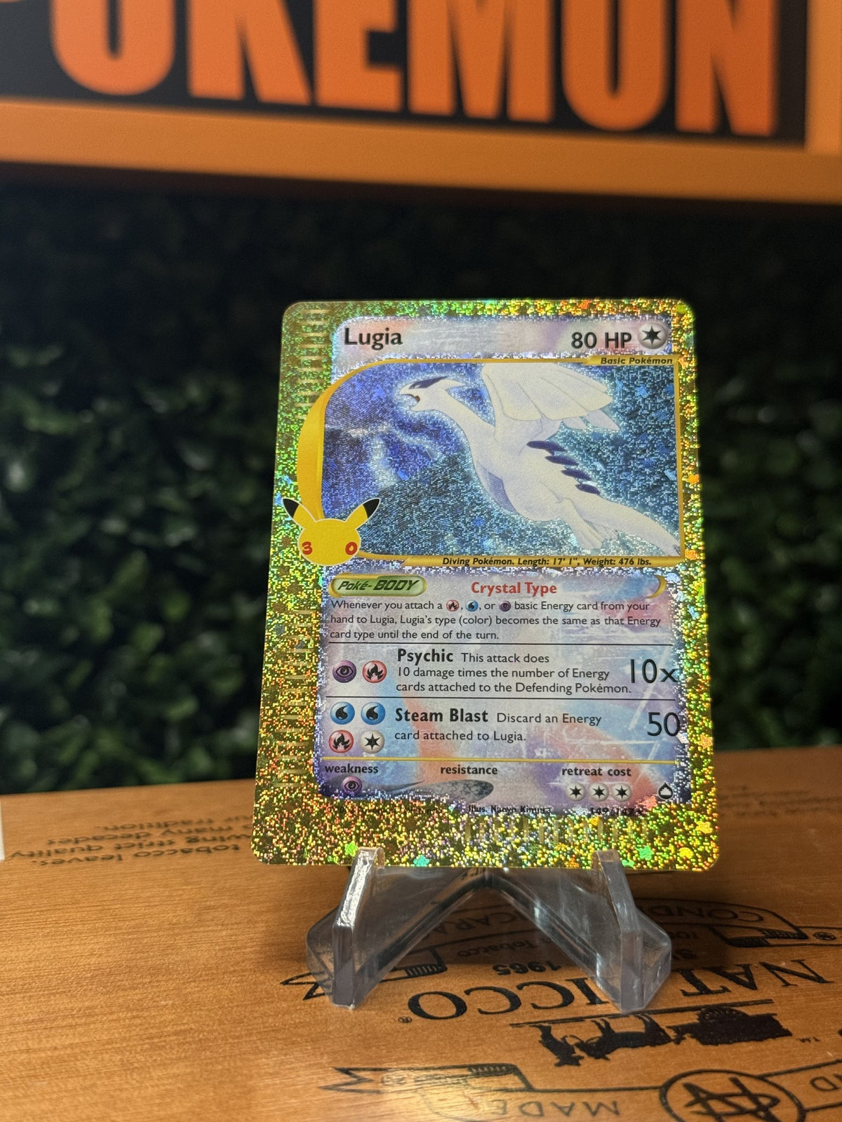 Lugia collector card with gold glitter-style border and anniversary-style mark